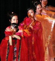 Photo of International students celebrating Night of Nations on stage in the E Glenn Giltz Auditorium.