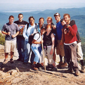 Photo of incoming Freshmen posing together, with the Adirondack mountains in the background