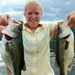 Photo of Nikki Eddy holding 2 prize fish