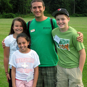 Photo of student wiith his siblings