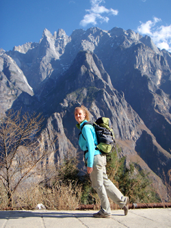 Photo of Allison Thompson in front of a tall mountain range