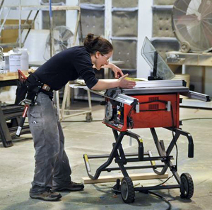 Photo of Allison Oropallo using saw table