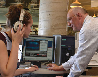 Photo of librarian assisting student in Feinberg Library