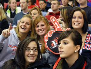 Photo of students watching SUNY Plattsburgh men's hockey team play Oswego at Homecoming