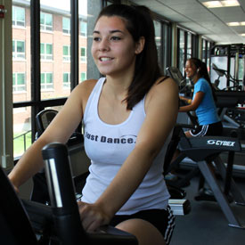 Photo of students working out in the satellite fitness center