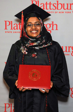 Photo of SUNY Plattsburgh student holding her diploma
