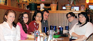 Photo of students at dinner after the conference