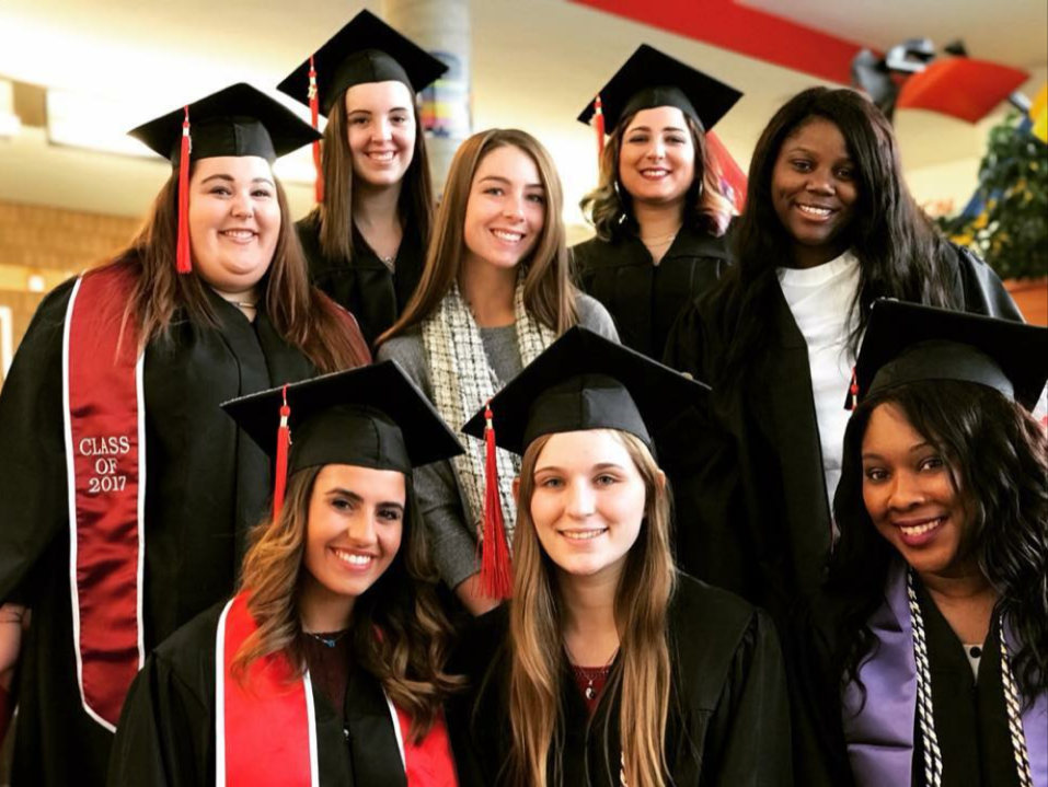 Group portrait of graduating seniors in their academic caps and gowns