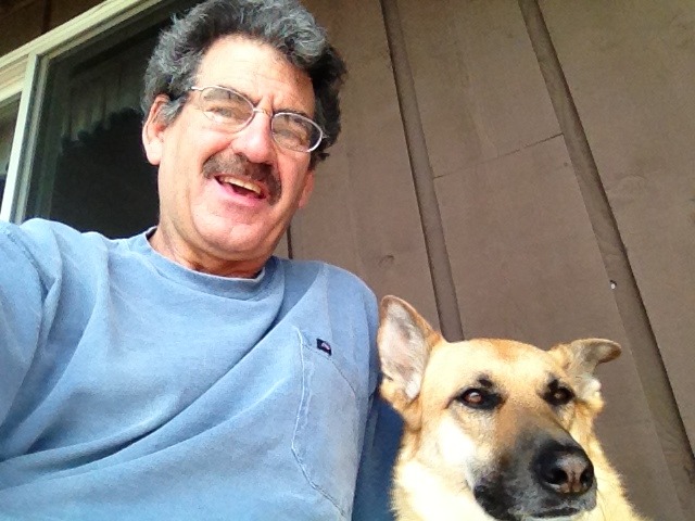 Image of smiling man with his dog