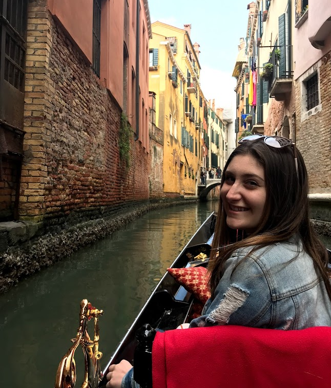 Alivia in a boat in Italy