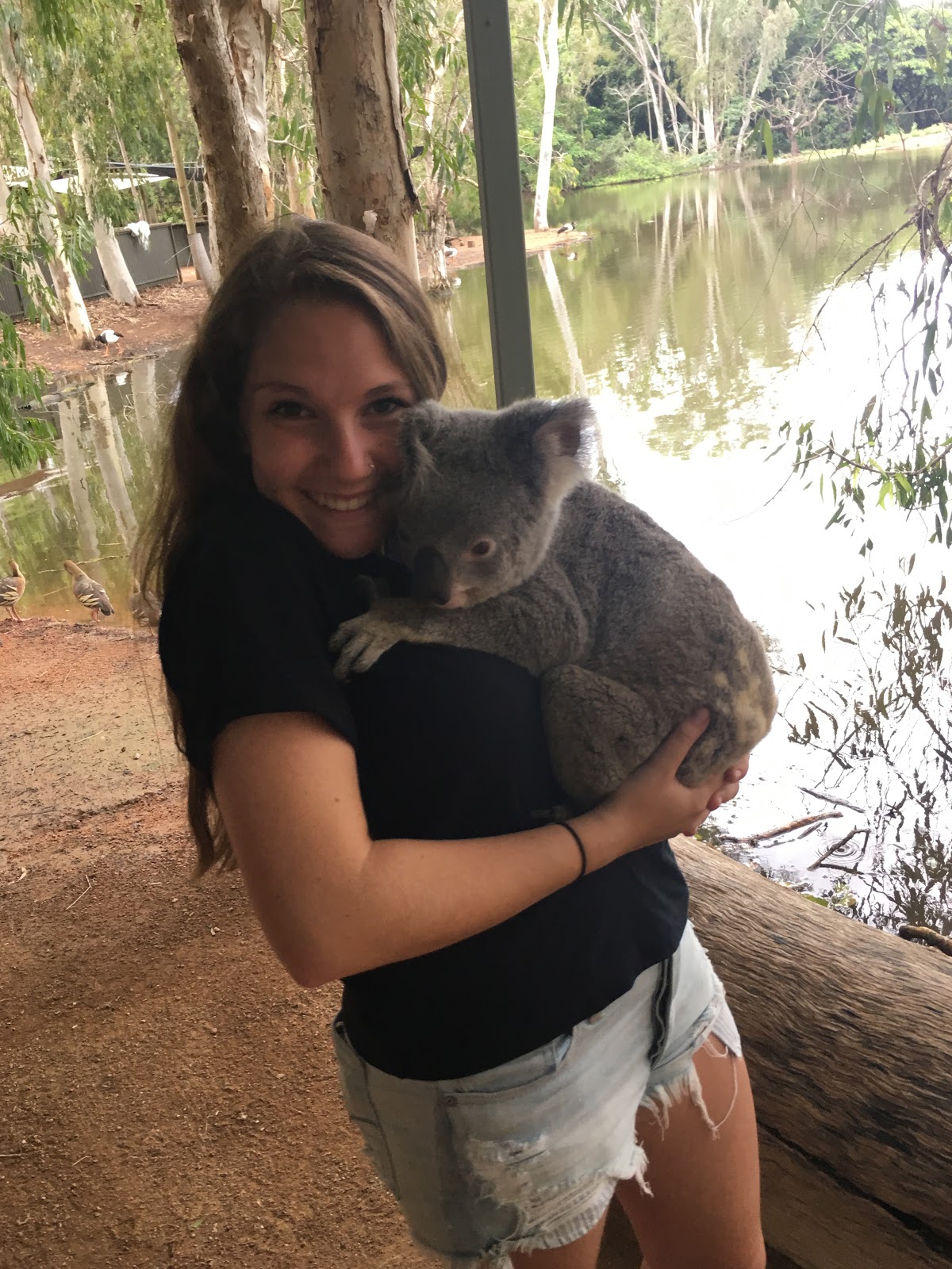 Lia holds a koala
