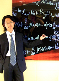 Xiao explains a mathematical equation on the board