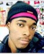 photo of African-presenting young man in a hat