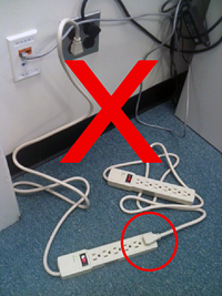 Unsafe, power strips and extention cords plugged into each other instead of directly into the wall outlet