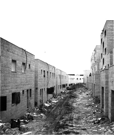 Image of an alley between rows of buildings