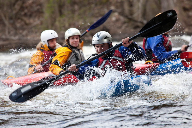 Students kayaking on a river