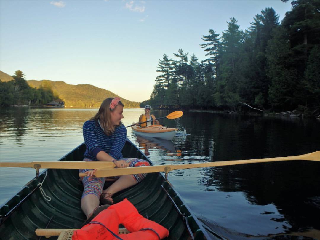 Steffaney Wilcox paddling a canoe with friends