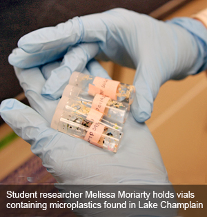 Student researcher Melissa Moriarty holds vials containing microplastics found in Lake Champlain as part of research she is doing under the tutelage of Dr. Danielle Garneau, associate professor in the Center for Earth and Environmental Science.