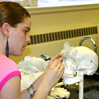 Photo of Anna Brost in the forensic anthropology lab