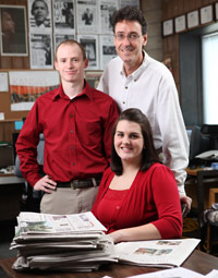 Photo of students and their advisor in the Cardinal Points office