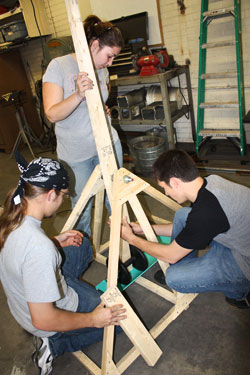 Photo of SUNY Plattsburgh students building a working trebuchet