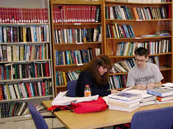 Two students working in the commons