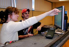 Dr. Pater discusses experiment results with a student in the classroom