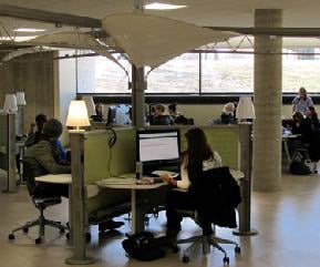 Students working in the lab at spacious individual work stations 