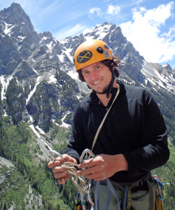 Photo of Mike Bowyer on a rock climbing expedition in the mountains