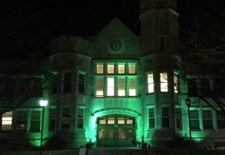 SUNY Plattsburgh Honors Veterans with Veterans Day Flag Service, Lighting Hawkins Hall Green