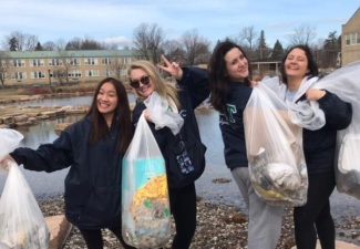 Fraternity, Sorority Members Lead Day of Caring Effort to Clean Up Community