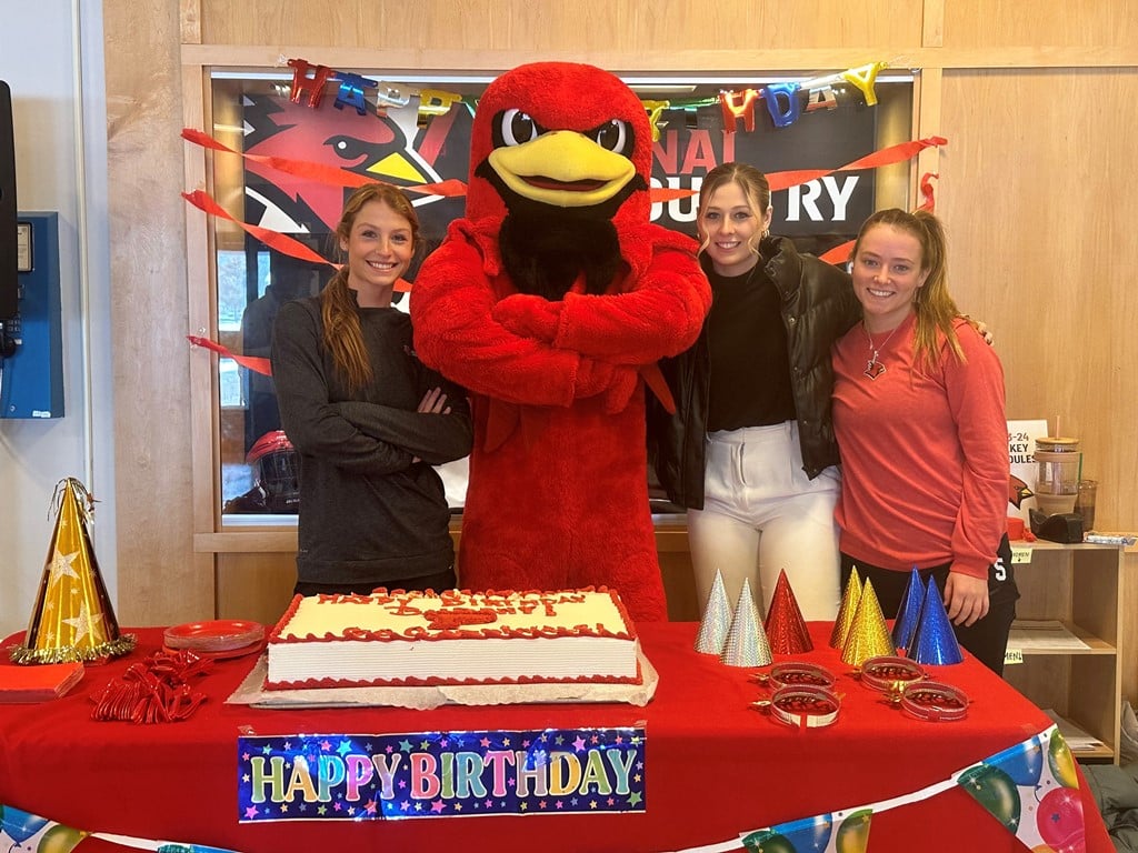 Burghy and Cardnal women hockey players