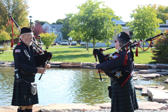 bagpipers at pond