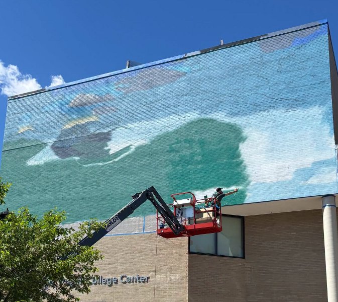 brendon paints ACC mural
